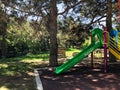 Childish playground in city park. Swing carousel in park for children Royalty Free Stock Photo