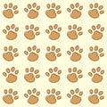 Brown cat paws pattern on vanilla background