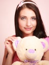 Childish woman infantile girl hugging teddy bear Royalty Free Stock Photo