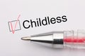 Childless - checkbox with a cross on white paper with pen. Checklist concept Royalty Free Stock Photo