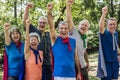 Childlike seniors wearing superhero costumes Royalty Free Stock Photo