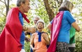 Childlike seniors wearing superhero costumes Royalty Free Stock Photo