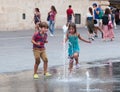 Childre plays with water Royalty Free Stock Photo