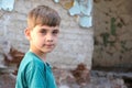Children in an abandoned and destroyed building in the zone of military and military conflicts. The concept of social problems of
