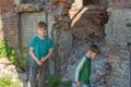 Children in an abandoned and destroyed building in the zone of military and military conflicts. The concept of social problems of