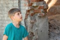 Children in an abandoned and destroyed building in the zone of military and military conflicts. The concept of social problems of