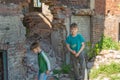 Children in an abandoned and destroyed building in the zone of military and military conflicts. The concept of social problems of