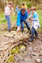 Children And Adults Carrying Out Conservation Work On Stream Royalty Free Stock Photo