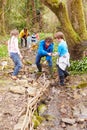 Children And Adults Carrying Out Conservation Work On Stream Royalty Free Stock Photo