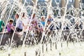 children and adults saved from summer heat near fountain, Tomsk Russia June 2022. selective focus