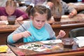 Children aged 6-9 years attend free drawing workshop during the open day in watercolors school