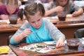 Children aged 6-9 years attend free drawing workshop during the open day in watercolors school