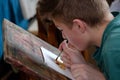 Children aged 6-9 years attend free drawing workshop during the open day in watercolors school