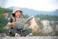 Children asian girl holding maps and travel backpacks standing in the mountain.