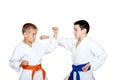 Children athletes in kimono perform techniques karate Royalty Free Stock Photo