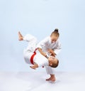 Children athletes train judo throws Royalty Free Stock Photo