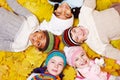 Children on autumnal leaves Royalty Free Stock Photo