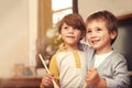 Children, baking and thinking in kitchen with spoon and creative with ingredients for christmas cake. Boys, bonding Royalty Free Stock Photo