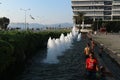 Children bathe in a fountain in the central square of Izmir