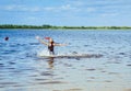 Children bathe in the river. The concept of a summer holiday