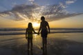 Children bathing on the beach at dusk Royalty Free Stock Photo