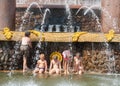 Children bathing near a fountain