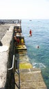 Children bathing in the port of Arrieta in Lanzarote