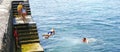 Children bathing in the port of Arrieta in Lanzarote