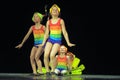 Children in bathing suits dancing on stage Royalty Free Stock Photo