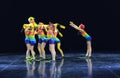 Children in bathing suits dancing on stage Royalty Free Stock Photo