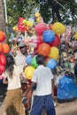 Children baying balloons from a vendor