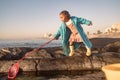 Children, beach and fishing with a girl using a net in a rock pool while having fun on summer vacation. Water, nature Royalty Free Stock Photo