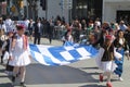 Children bearing the national flag on parade