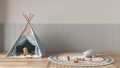 Children bedroom background with copy space in white and pastel tones, parquet floor, velvet wall panel, colored tepee, round Royalty Free Stock Photo