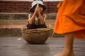 Children begging during the procession of local monks