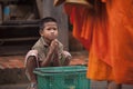 Children begging during the procession of local monks