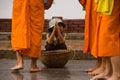 Children begging during the procession of local monks