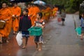 Children begging during the procession of local monks