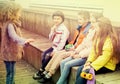 Children on bench playing children`s games