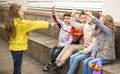 Children on bench playing children`s games