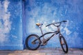 Children bicycle on blue wall Royalty Free Stock Photo