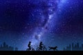 Children on bicycles. Little boy, girl and dog. Milky Way at night sky Royalty Free Stock Photo