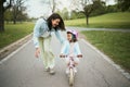 Children, bike and a mother teaching her girl how to cycle in a park while bonding together as a family. Nature, love Royalty Free Stock Photo