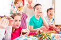 Children at birthday party with muffins and cake Royalty Free Stock Photo