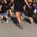 Children with Black Shirt Running in the Park with Young Teacher