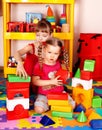 Children with block in play room. Royalty Free Stock Photo