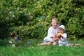 Children blow bubbles