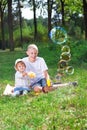 Children blow bubbles Royalty Free Stock Photo