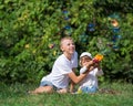 Children blow bubbles Royalty Free Stock Photo