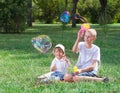 Children blow bubbles Royalty Free Stock Photo